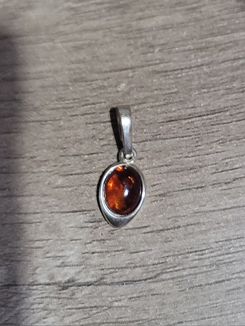 Sterling Silver Amber Oval Pendant in Deep Cognac